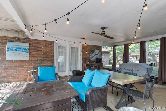 view of patio featuring visible vents, outdoor dining area, and ceiling fan