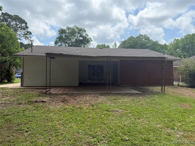 back of house with a lawn, a patio area, and fence