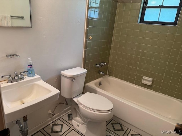 3008 Baffin Dr, Montgomery, AL 36110 - bathroom featuring a sink, tile patterned flooring, toilet, and shower / tub combination