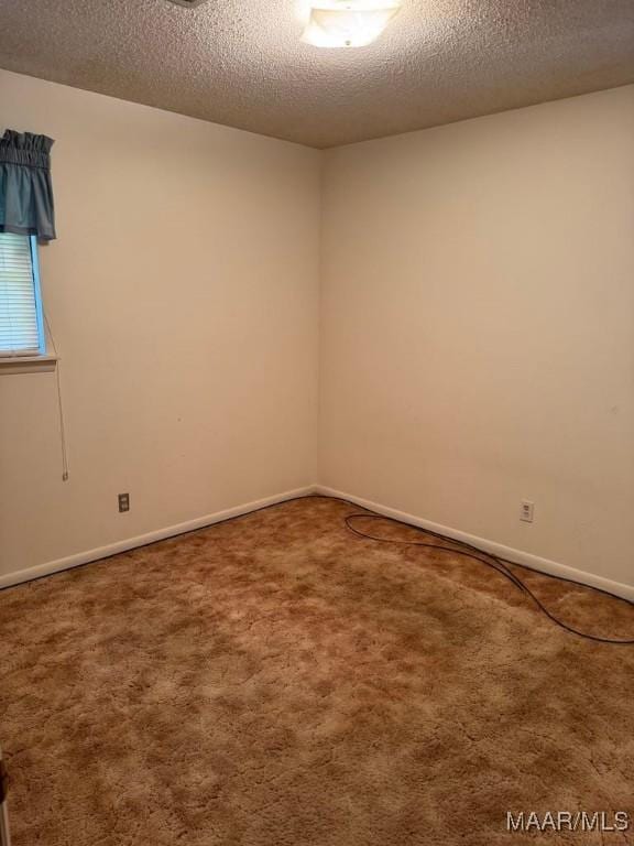 3008 Baffin Dr, Montgomery, AL 36110 - unfurnished room with a textured ceiling, baseboards, and carpet