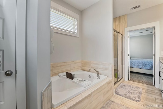 full bathroom with a bath, a shower stall, connected bathroom, and visible vents
