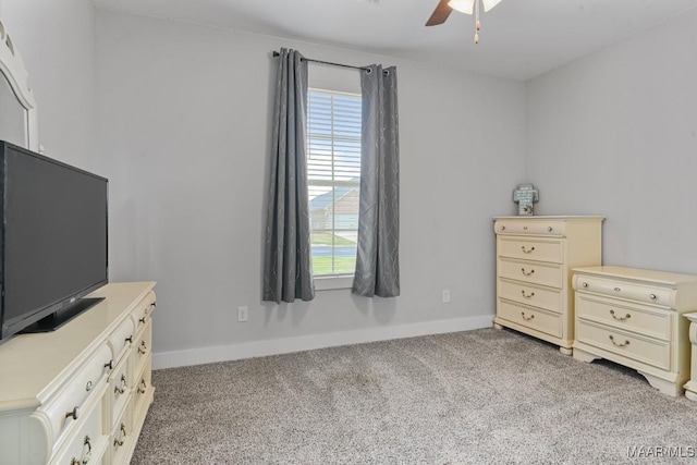 bedroom with carpet floors, baseboards, and multiple windows