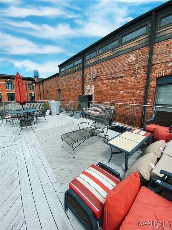 246 N Court St Unit J, Montgomery, AL 36104 - wooden deck featuring outdoor dining area and outdoor lounge area