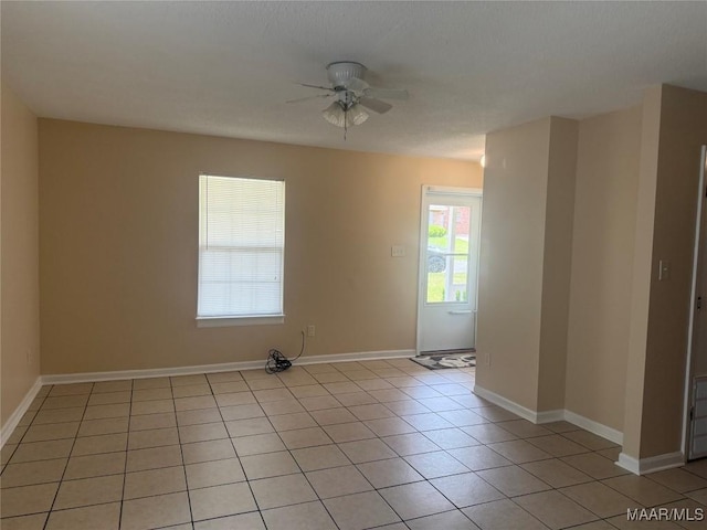 6253 S Hampton Dr, Montgomery, AL 36116 - unfurnished room featuring baseboards, ceiling fan, and light tile patterned floors