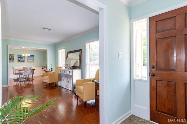 206 Choctaw Dr, Montgomery, AL 36117 - entrance foyer with a chandelier, baseboards, wood finished floors, and ornamental molding