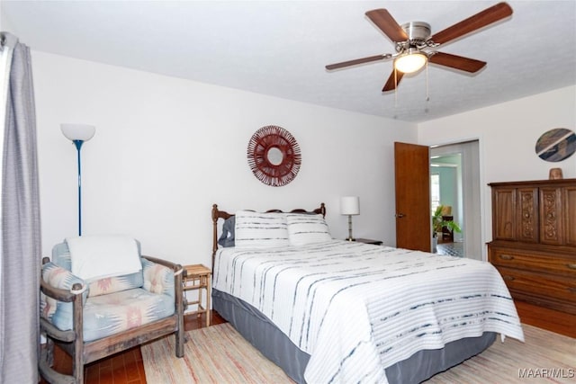 bedroom featuring ceiling fan and wood finished floors