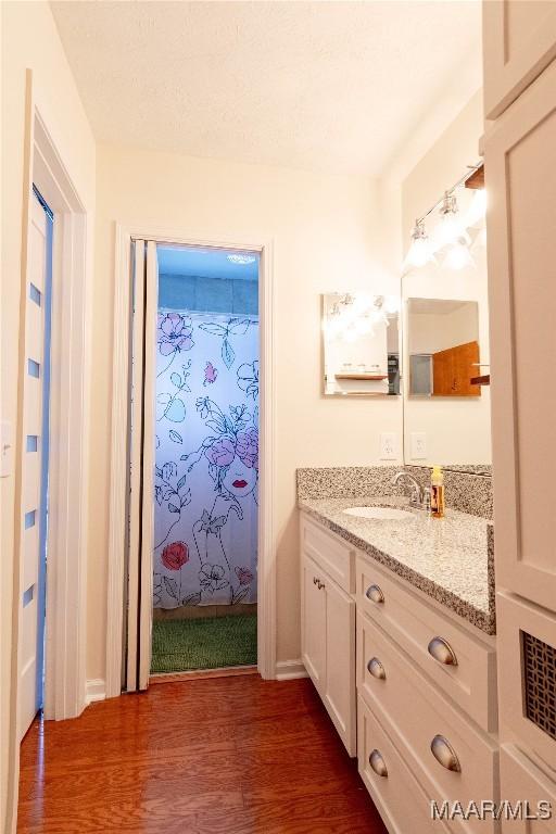 206 Choctaw Dr, Montgomery, AL 36117 - bathroom featuring wood finished floors and vanity