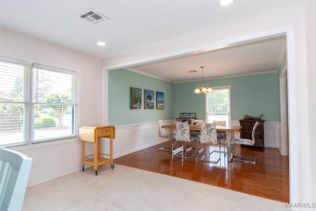 206 Choctaw Dr, Montgomery, AL 36117 - dining area featuring a chandelier, wainscoting, crown molding, a decorative wall, and recessed lighting