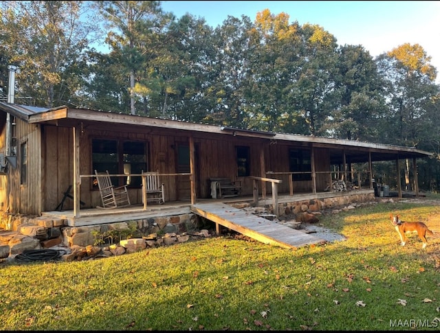 1551 Barnesville Loop, Dadeville, AL 36853 - exterior space featuring a yard and a patio area