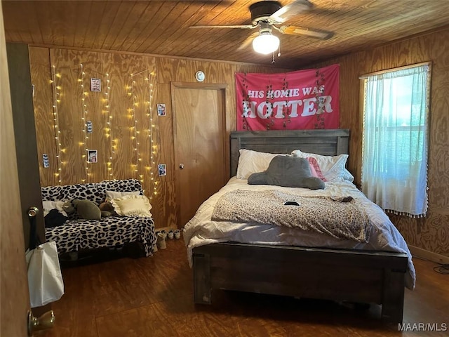 bedroom featuring wood ceiling and wood walls