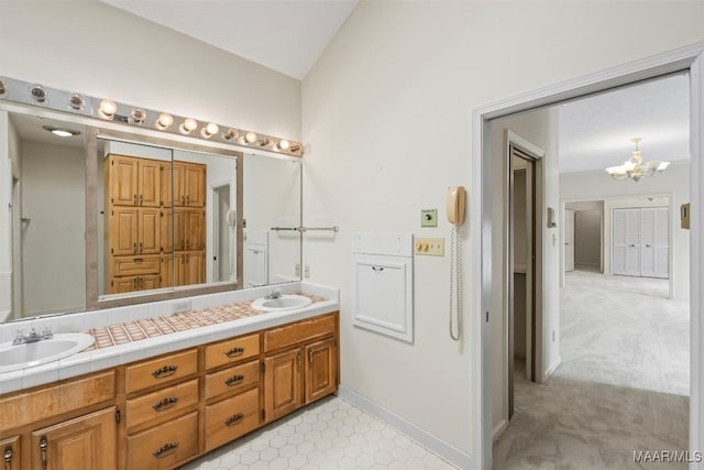 1520 Meriwether Rd, Montgomery, AL 36117 - full bathroom with a chandelier, double vanity, and lofted ceiling