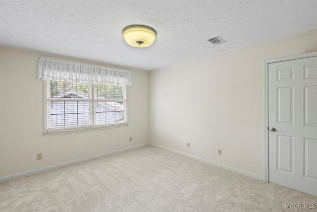 1520 Meriwether Rd, Montgomery, AL 36117 - empty room with carpet floors, baseboards, and a textured ceiling