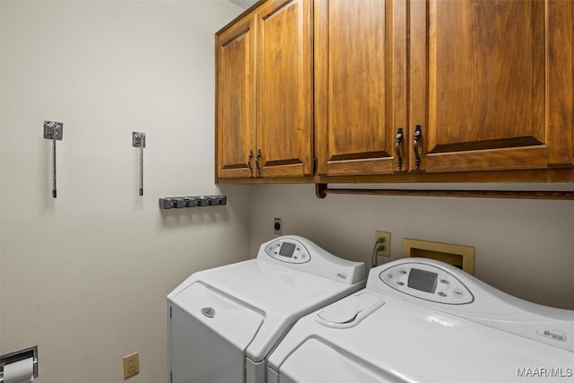 1520 Meriwether Rd, Montgomery, AL 36117 - washroom with cabinet space and washer and clothes dryer