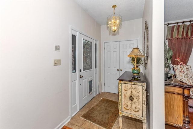 3146 Malone Dr, Montgomery, AL 36106 - tiled entryway featuring a chandelier