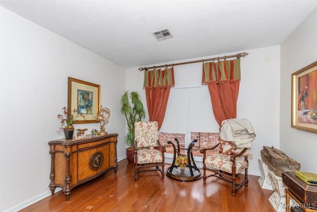 3146 Malone Dr, Montgomery, AL 36106 - sitting room featuring baseboards, wood finished floors, and visible vents