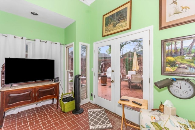 3146 Malone Dr, Montgomery, AL 36106 - doorway featuring french doors, baseboards, and brick patterned floor