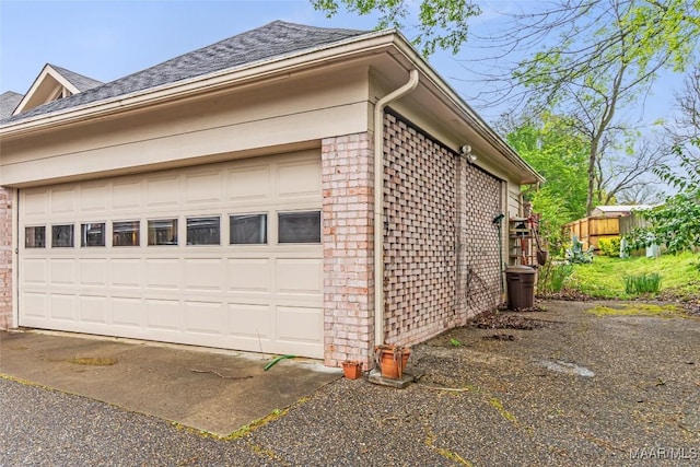 3146 Malone Dr, Montgomery, AL 36106 - view of side of property with brick siding, a garage, and roof with shingles