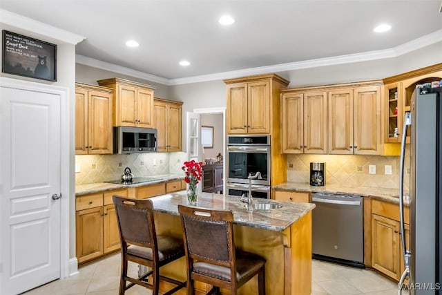 kitchen with backsplash, light tile patterned floors, appliances with stainless steel finishes, and light stone counters