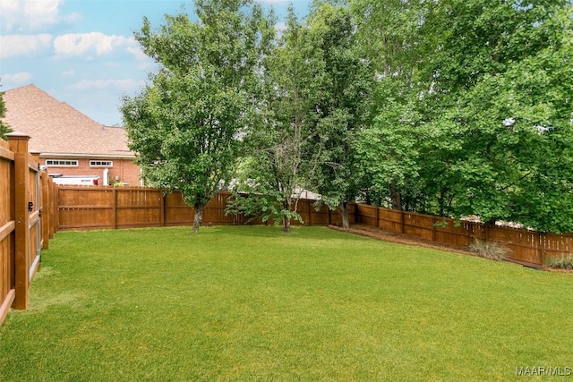 view of yard featuring a fenced backyard
