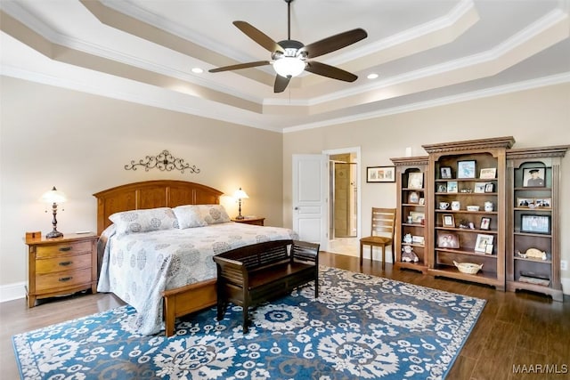 bedroom featuring a ceiling fan, crown molding, wood finished floors, a raised ceiling, and recessed lighting
