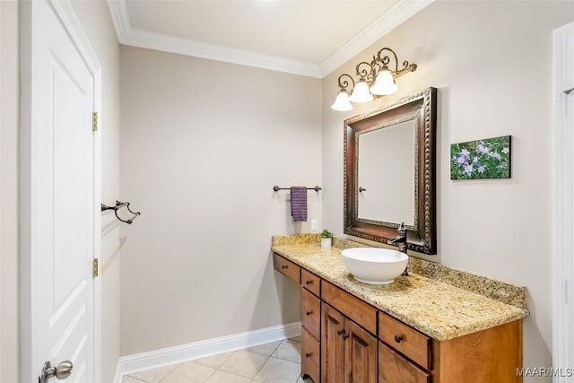 bathroom featuring vanity, ornamental molding, baseboards, and tile patterned floors