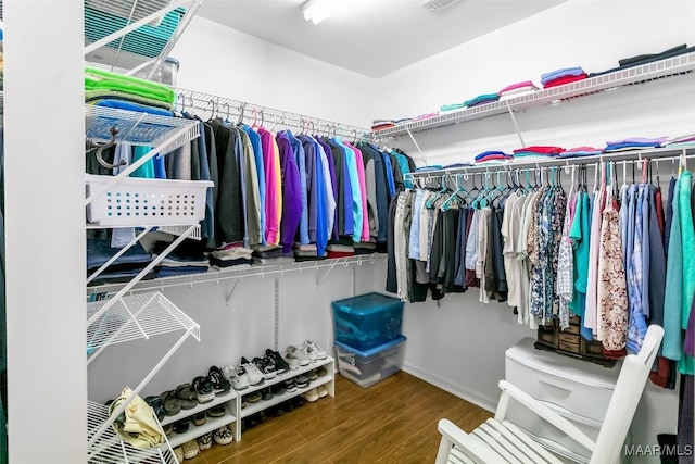 spacious closet with wood finished floors