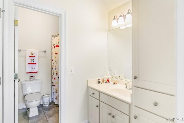 full bathroom with vanity, baseboards, tile patterned floors, and toilet