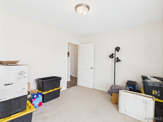 playroom with carpet floors and baseboards