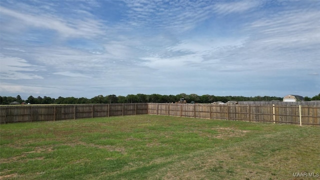 view of yard with a fenced backyard