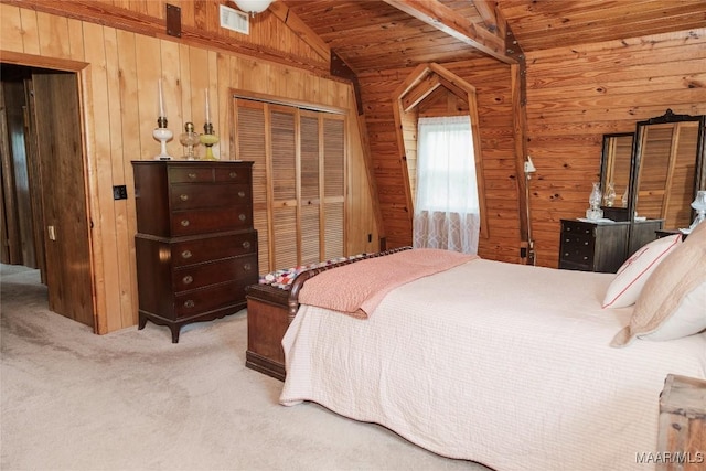 2755 Cherokee Trl, Tallassee, AL 36078 - bedroom with visible vents, wooden walls, light colored carpet, wood ceiling, and vaulted ceiling