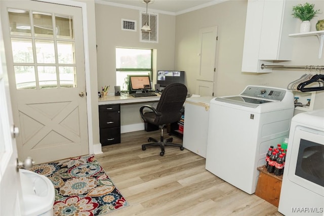 2755 Cherokee Trl, Tallassee, AL 36078 - laundry room with laundry area, separate washer and dryer, light wood-type flooring, visible vents, and ornamental molding