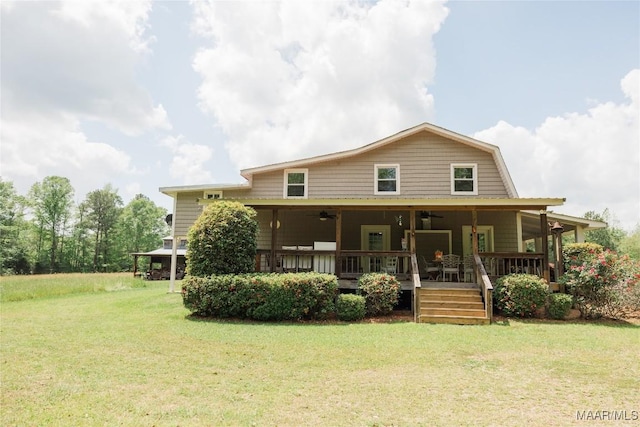 2755 Cherokee Trl, Tallassee, AL 36078 - back of house featuring a lawn, ceiling fan, and a gambrel roof