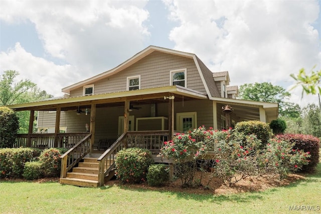 2755 Cherokee Trl, Tallassee, AL 36078 - back of house with a lawn, ceiling fan, and a gambrel roof