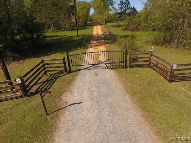 2755 Cherokee Trl, Tallassee, AL 36078 - view of gate with fence and a yard
