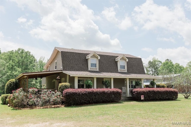 2755 Cherokee Trl, Tallassee, AL 36078 - view of property exterior featuring a lawn, a gambrel roof, roof with shingles, and covered porch