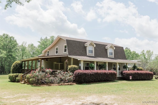 2755 Cherokee Trl, Tallassee, AL 36078 - view of property exterior with a gambrel roof, ceiling fan, roof with shingles, and a yard