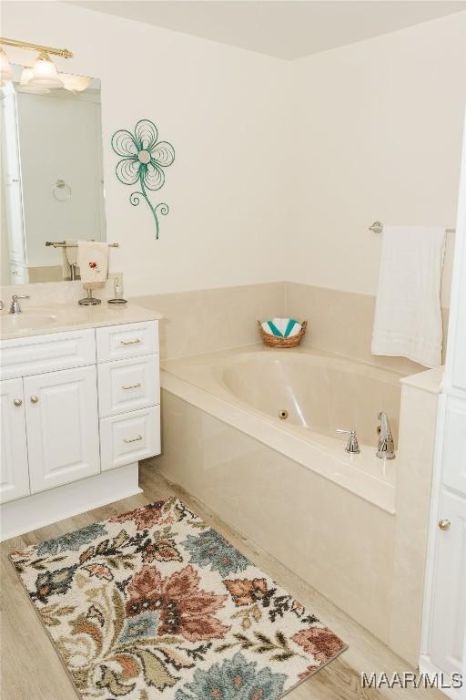 2755 Cherokee Trl, Tallassee, AL 36078 - bathroom featuring a jetted tub and vanity
