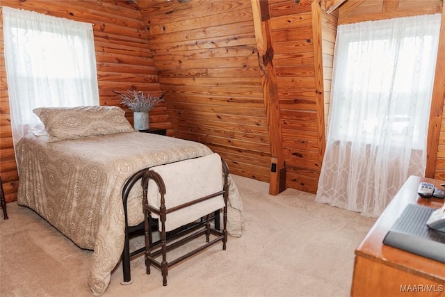2755 Cherokee Trl, Tallassee, AL 36078 - bedroom featuring log walls and light carpet