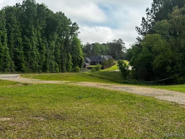 view of home's community with a forest view