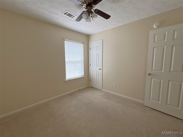 1672 Hawthorne Ln, Prattville, AL 36066 - unfurnished bedroom with light carpet, a textured ceiling, baseboards, visible vents, and a closet