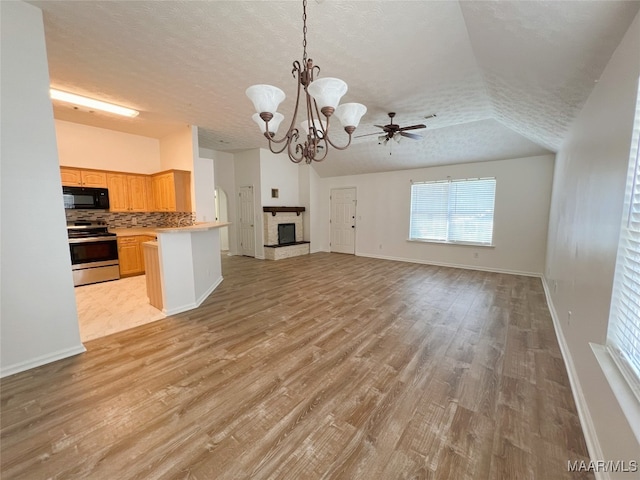 1672 Hawthorne Ln, Prattville, AL 36066 - kitchen featuring black microwave, open floor plan, light countertops, stainless steel electric range, and light wood finished floors