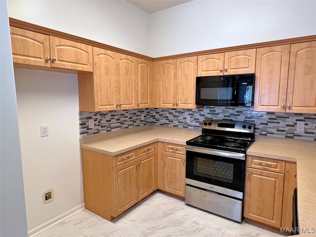 1672 Hawthorne Ln, Prattville, AL 36066 - kitchen with light countertops, black microwave, marble finish floor, and stainless steel range with electric stovetop