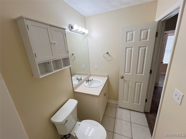 1672 Hawthorne Ln, Prattville, AL 36066 - bathroom featuring a textured ceiling, vanity, tile patterned floors, baseboards, and toilet