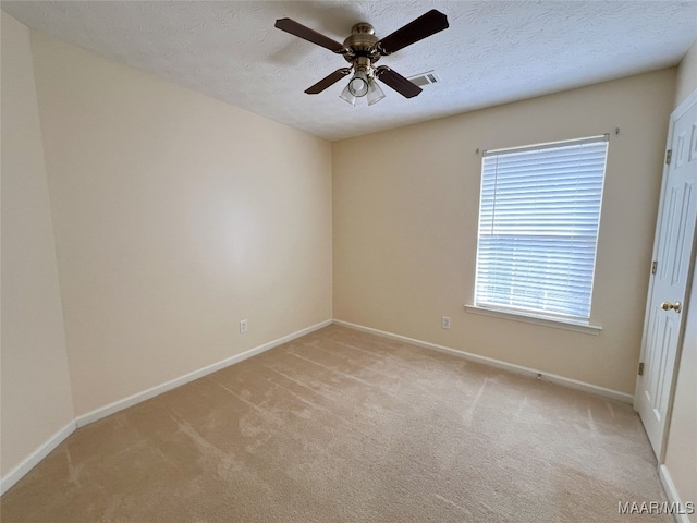 1672 Hawthorne Ln, Prattville, AL 36066 - empty room with light colored carpet, baseboards, ceiling fan, and visible vents