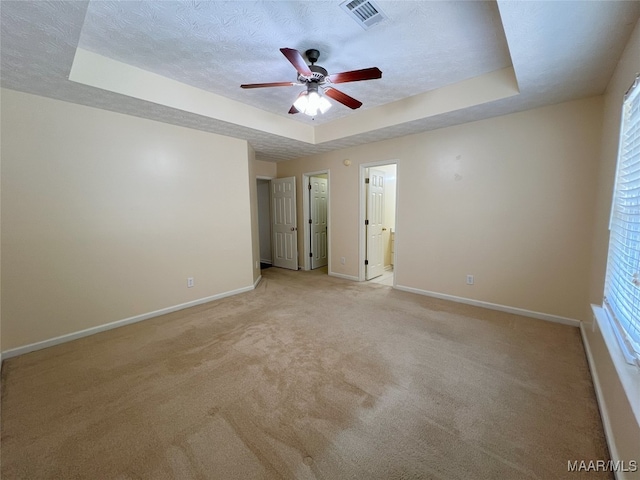 1672 Hawthorne Ln, Prattville, AL 36066 - spare room with ceiling fan, light colored carpet, visible vents, a raised ceiling, and baseboards