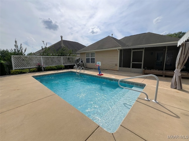 1672 Hawthorne Ln, Prattville, AL 36066 - view of swimming pool with a fenced in pool, fence, a patio, and a sunroom