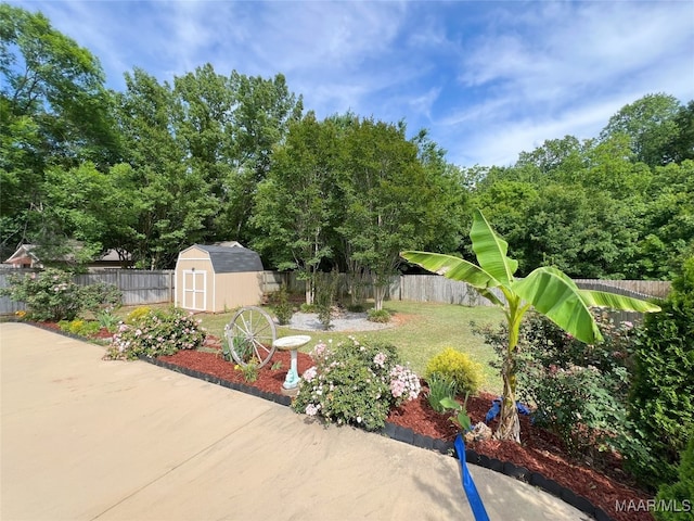 1672 Hawthorne Ln, Prattville, AL 36066 - exterior space featuring an outdoor structure, a patio, a fenced backyard, and a storage unit