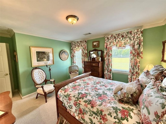 bedroom featuring baseboards, ornamental molding, carpet flooring, and visible vents
