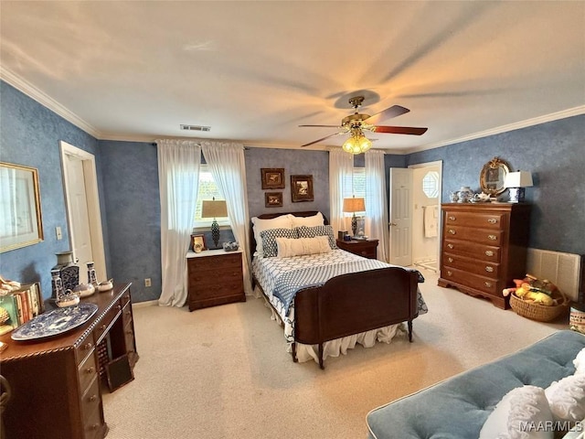 carpeted bedroom featuring visible vents, crown molding, and ceiling fan