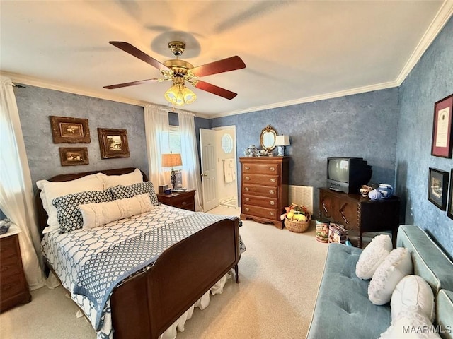 bedroom featuring crown molding, a ceiling fan, and carpet